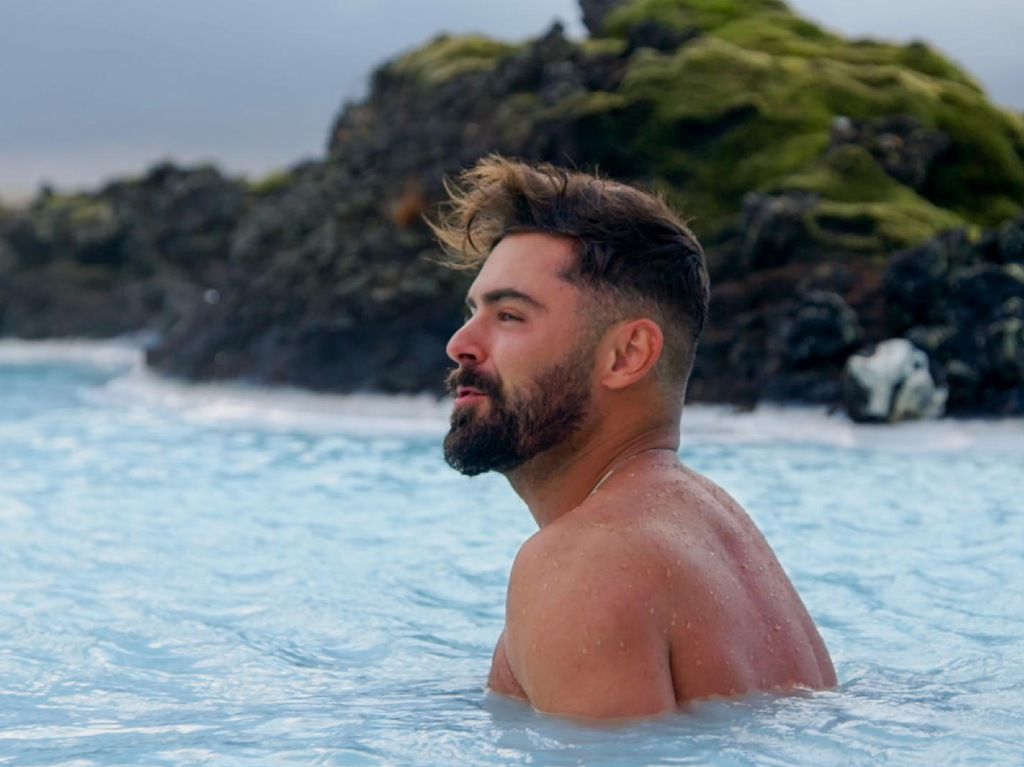 zac-efron-con-los-pies-en-la-tierra-en-netflix