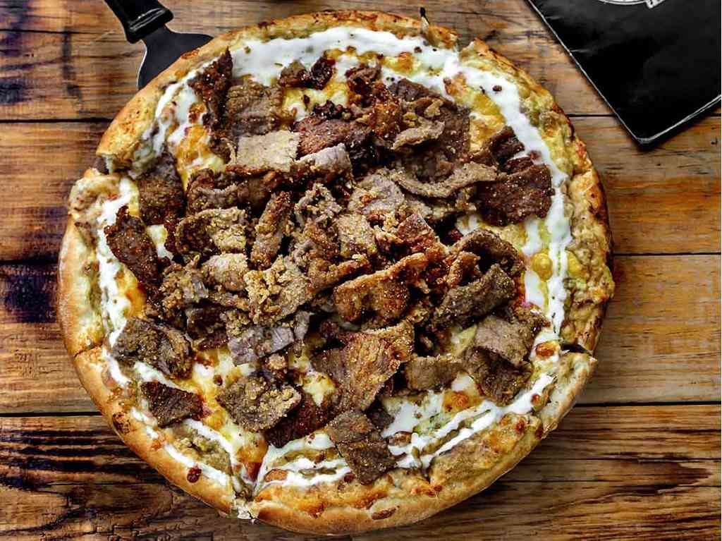 Pizza del Perro Negro regala comidas milanesa